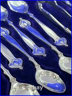 A fabulous set of silver art nouveau 12 tea spoons & tongs Sheffield 1905