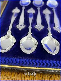 A fabulous set of silver art nouveau 12 tea spoons & tongs Sheffield 1905