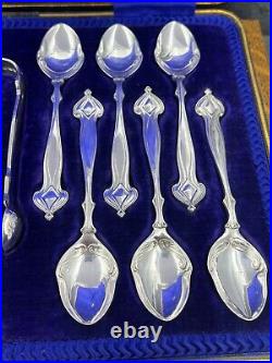 A fabulous set of silver art nouveau 12 tea spoons & tongs Sheffield 1905