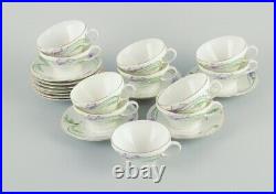 Rörstrand, Sweden. A set of eleven Art Nouveau porcelain teacups with saucers